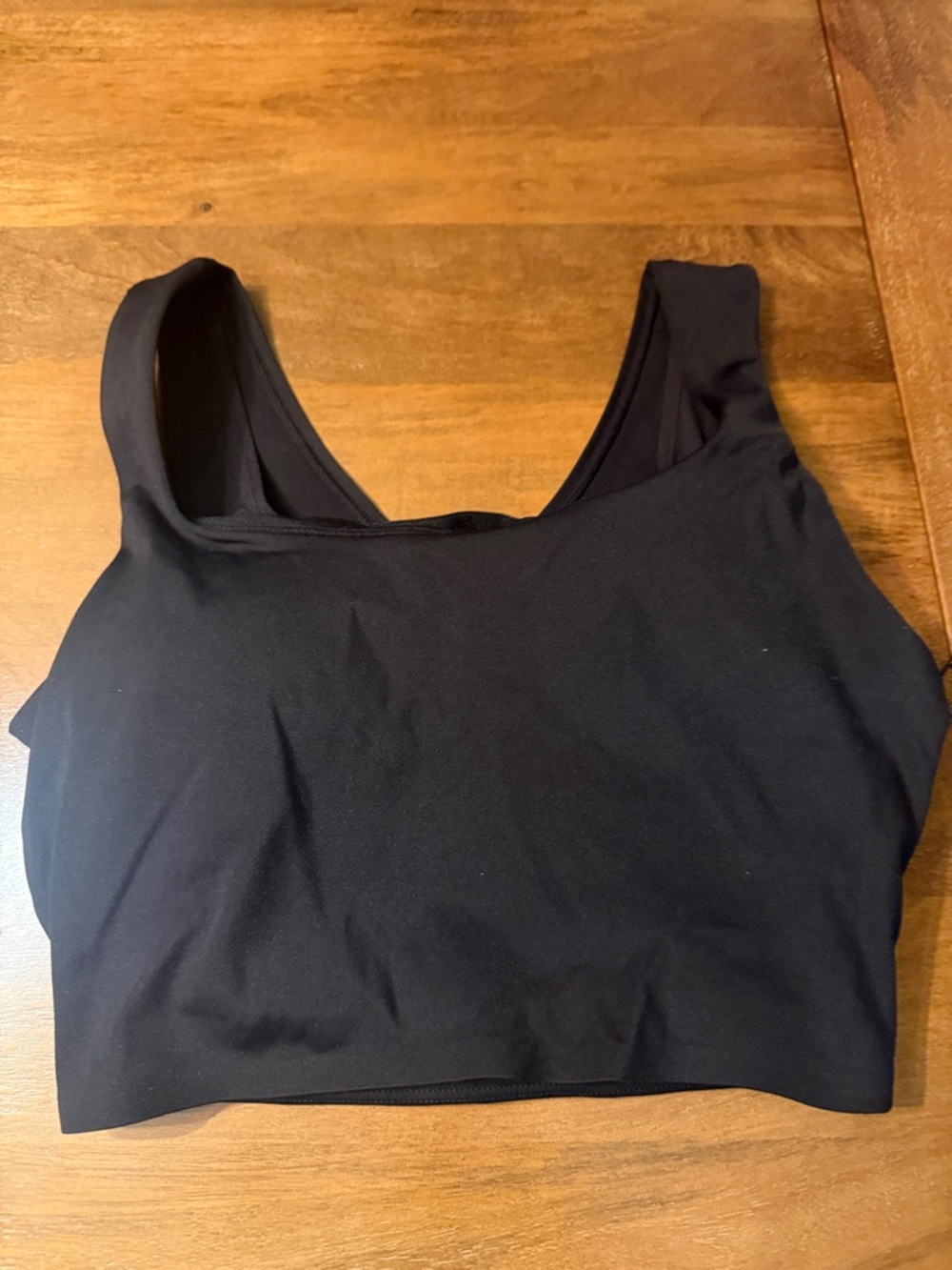 New with Tags Black Scoop Neck Sports Bra with open stripe back.